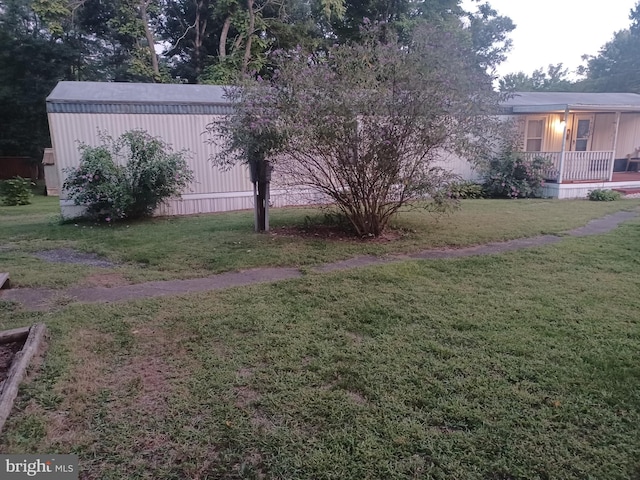 view of yard with covered porch