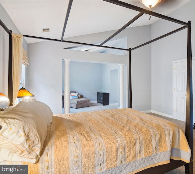 bedroom with visible vents, decorative columns, and baseboards