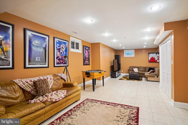 living room with recessed lighting, visible vents, baseboards, and light tile patterned floors