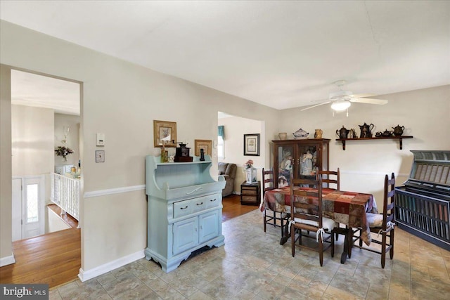 dining area featuring light hardwood / wood-style floors and ceiling fan