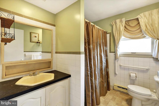 bathroom with vanity, a shower with curtain, toilet, tile walls, and a baseboard radiator