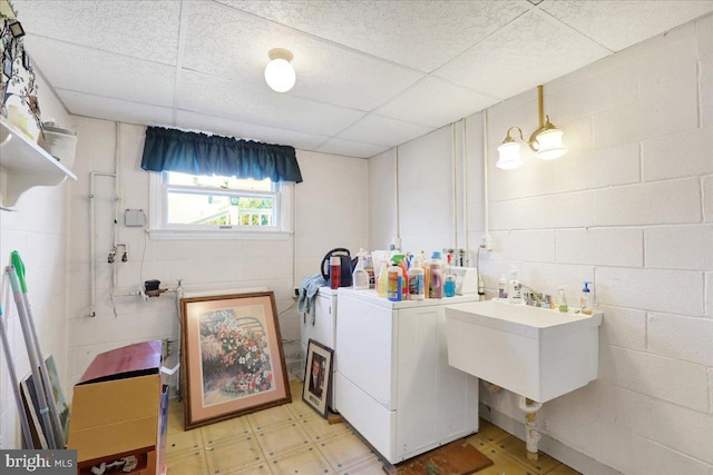 laundry area featuring washer / clothes dryer and sink