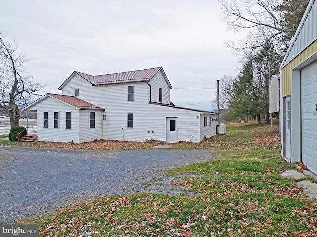 view of property exterior featuring a garage