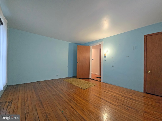 unfurnished room featuring hardwood / wood-style floors