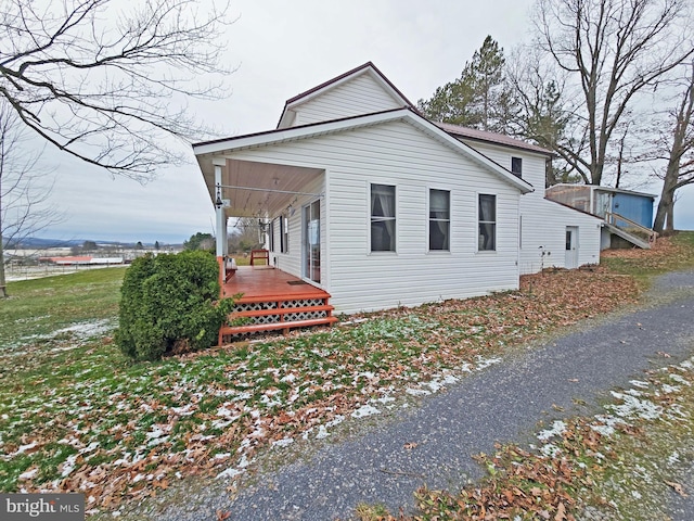 view of home's exterior featuring a porch