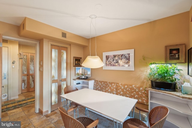 dining space featuring french doors