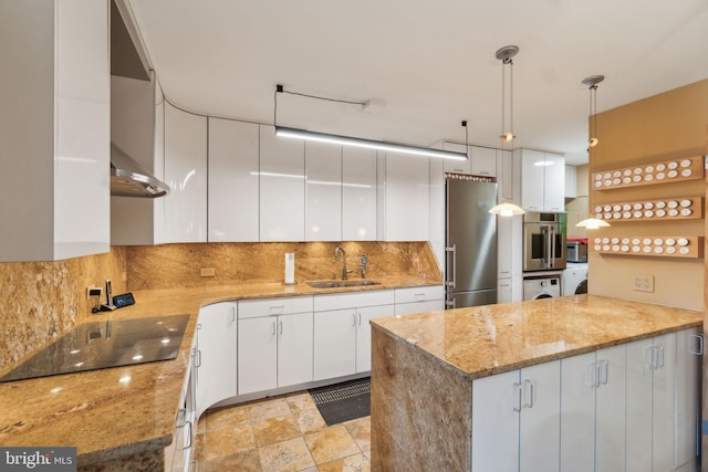 kitchen featuring white cabinets, appliances with stainless steel finishes, pendant lighting, and sink