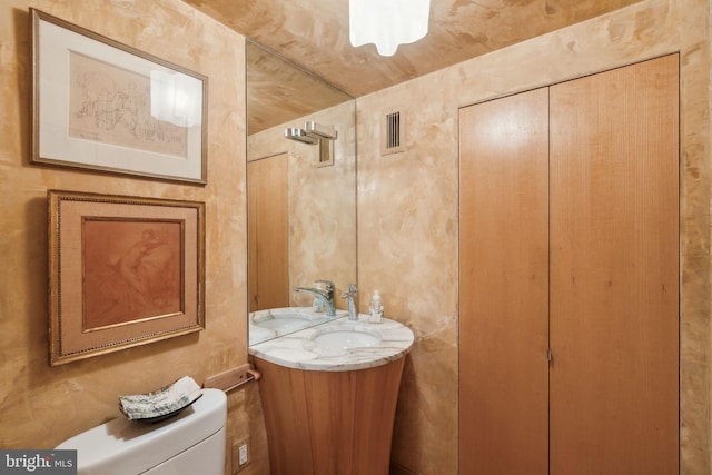 bathroom with vanity and toilet