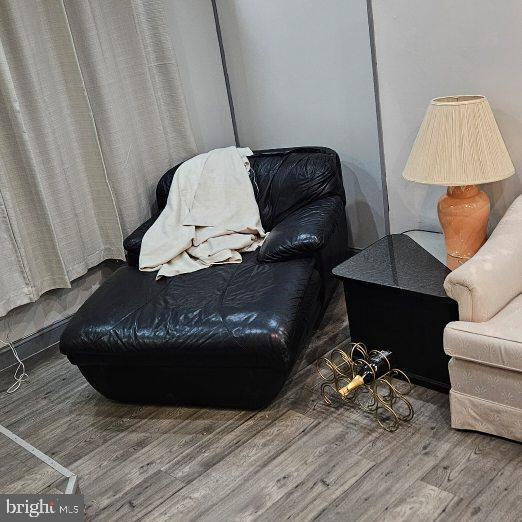 living area with hardwood / wood-style floors