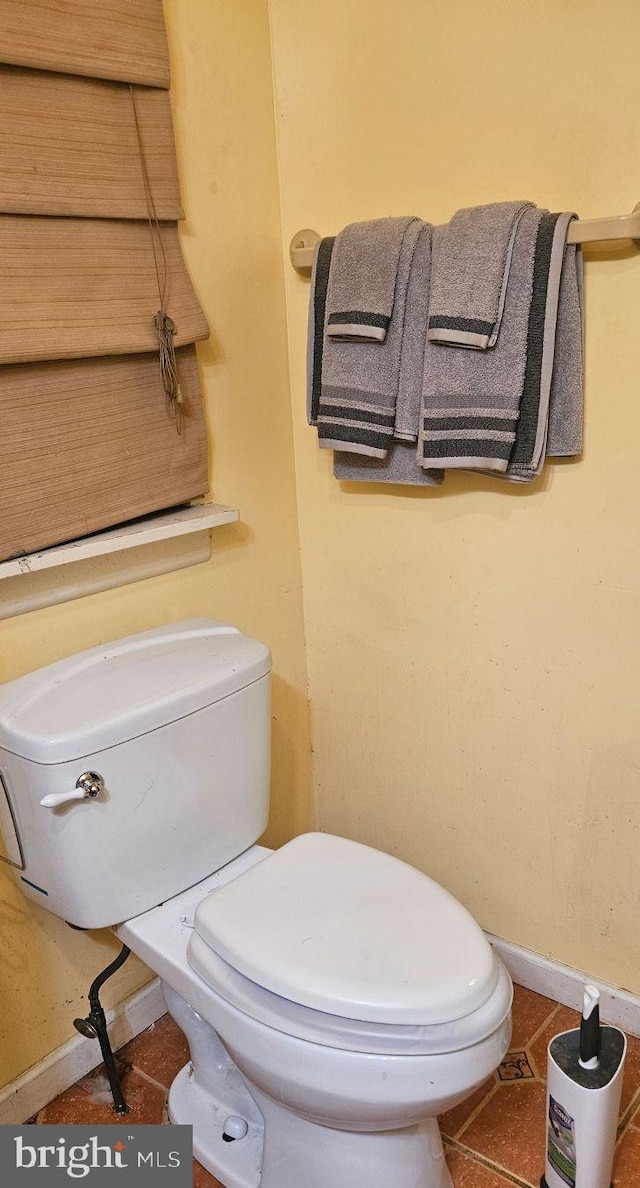 bathroom featuring tile patterned floors and toilet