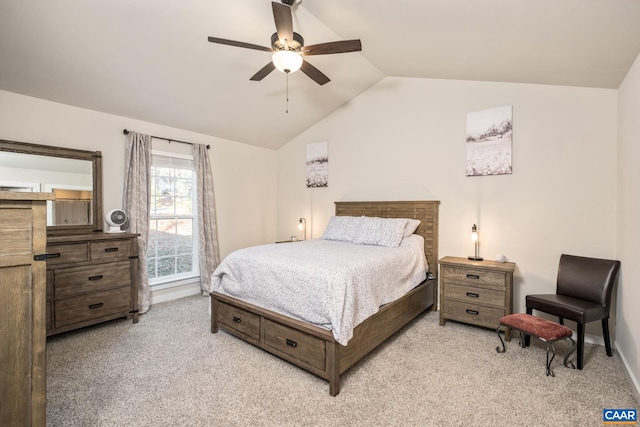 carpeted bedroom featuring vaulted ceiling and ceiling fan