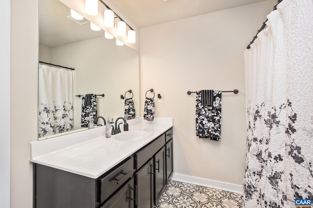 bathroom with vanity and tile patterned floors