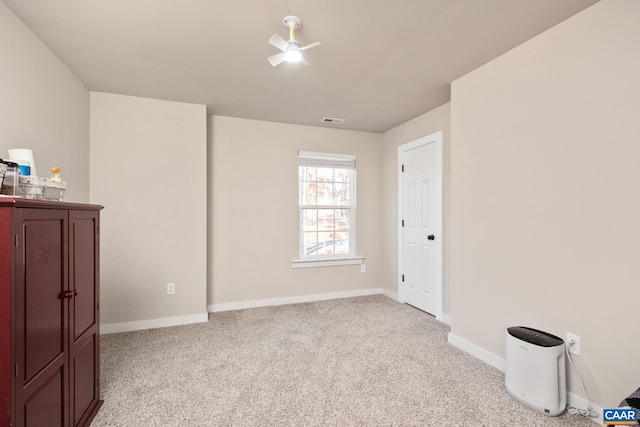 bedroom with ceiling fan and light colored carpet