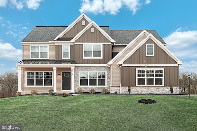 craftsman house featuring a front yard