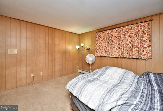 carpeted bedroom with wood walls and a baseboard radiator