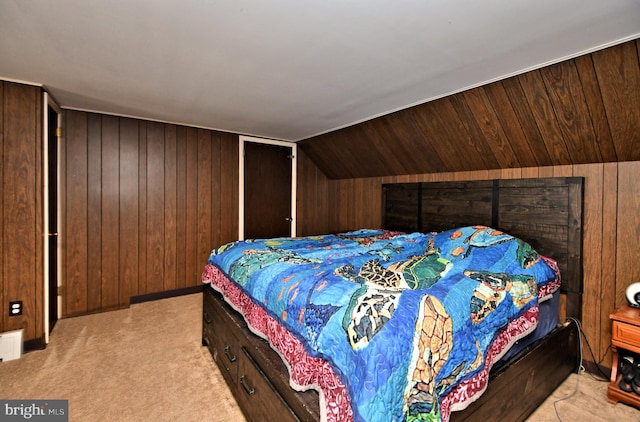 bedroom featuring wood walls, light colored carpet, and vaulted ceiling