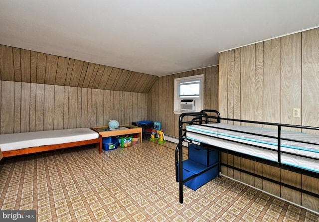 bedroom featuring wooden walls, cooling unit, and lofted ceiling