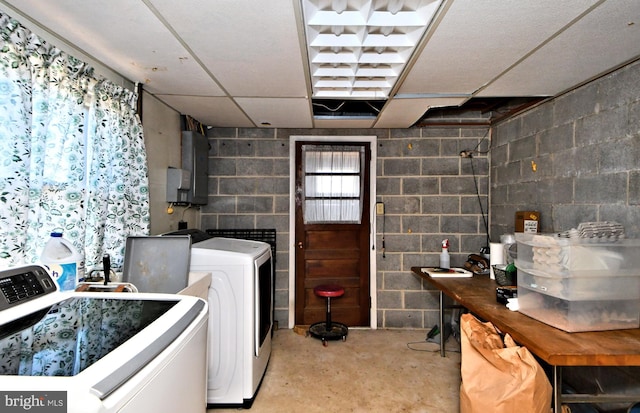 laundry area featuring washing machine and clothes dryer and electric panel