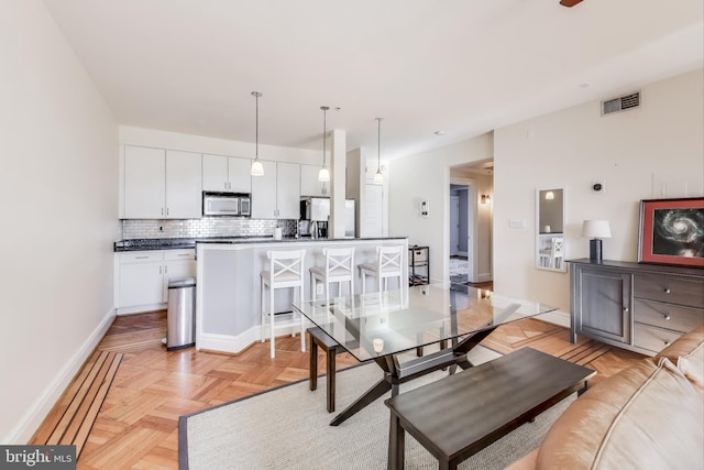 dining room with light parquet flooring