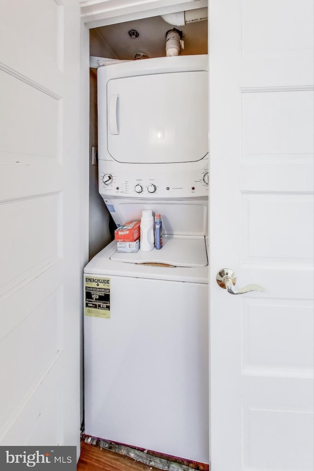 laundry room featuring stacked washer / dryer