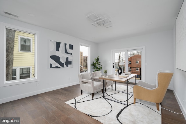 office area featuring dark wood-style floors, baseboards, and visible vents