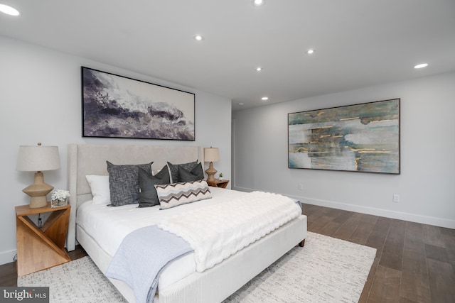 bedroom with recessed lighting, baseboards, and wood finished floors