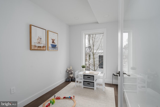 office featuring dark wood-style flooring and baseboards