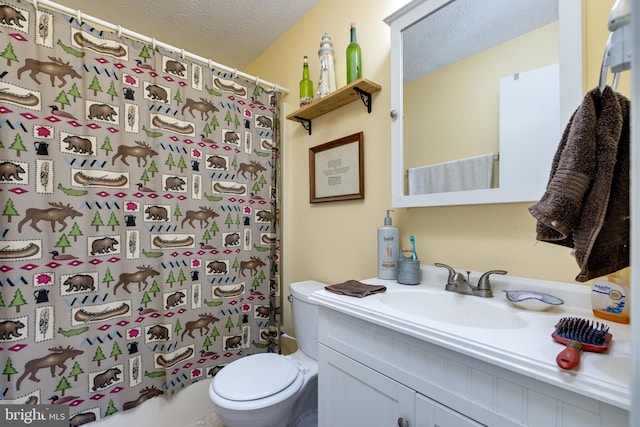 bathroom featuring vanity, a shower with curtain, a textured ceiling, and toilet