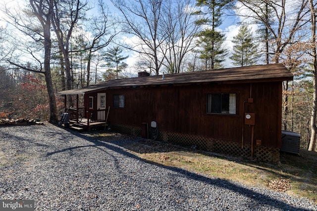 view of side of property with central AC unit