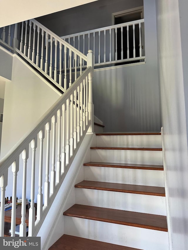 stairway with wood-type flooring