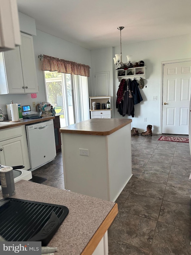 kitchen with white cabinetry, dishwasher, hanging light fixtures, an inviting chandelier, and a kitchen island