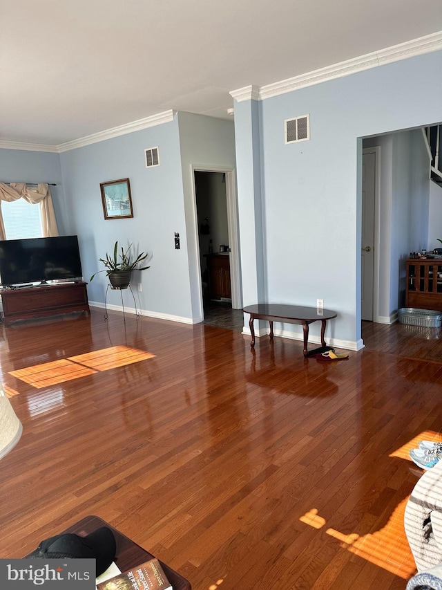 living room with dark wood-type flooring and ornamental molding