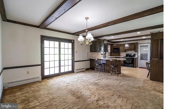 kitchen with black appliances, beamed ceiling, a baseboard radiator, and a kitchen bar