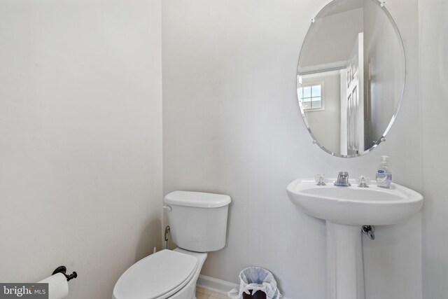 bathroom with tile patterned floors and toilet