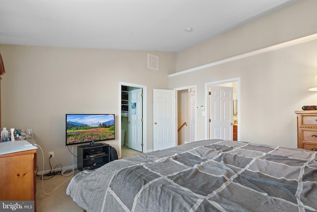 carpeted bedroom with vaulted ceiling