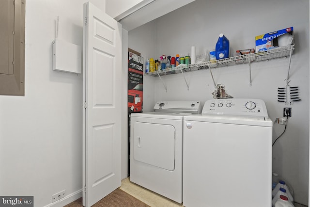 washroom with washing machine and dryer and electric panel