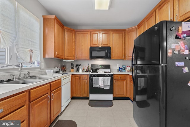 kitchen with sink and black appliances