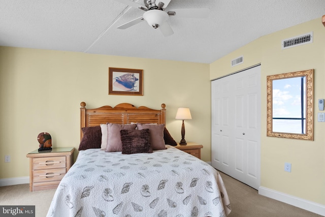 bedroom with light carpet, a closet, and ceiling fan