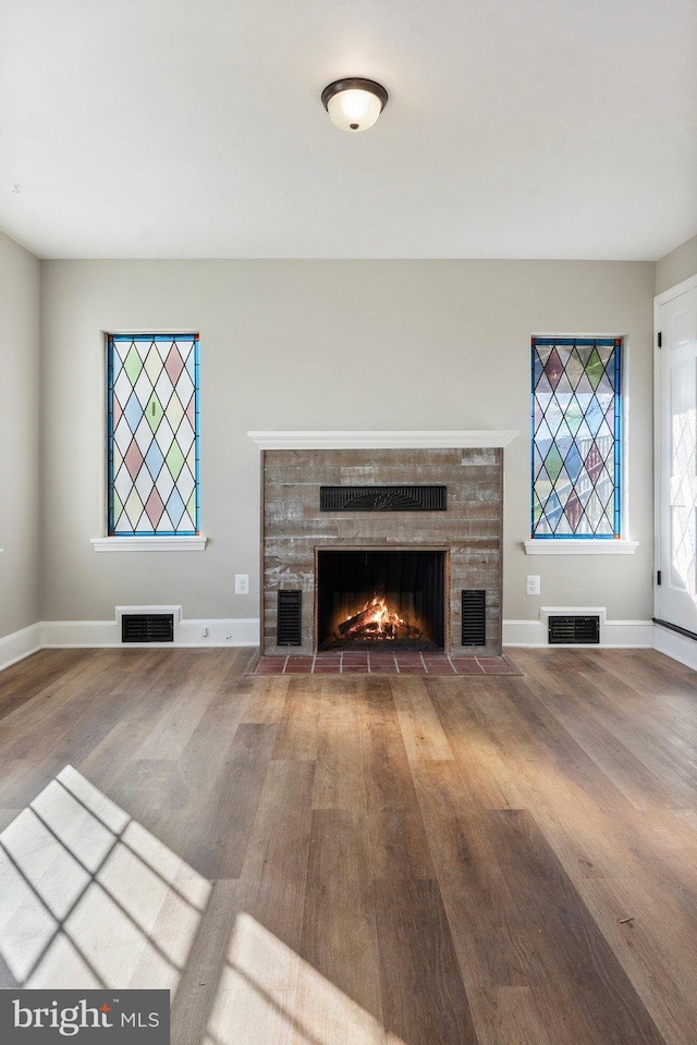 unfurnished living room with hardwood / wood-style floors