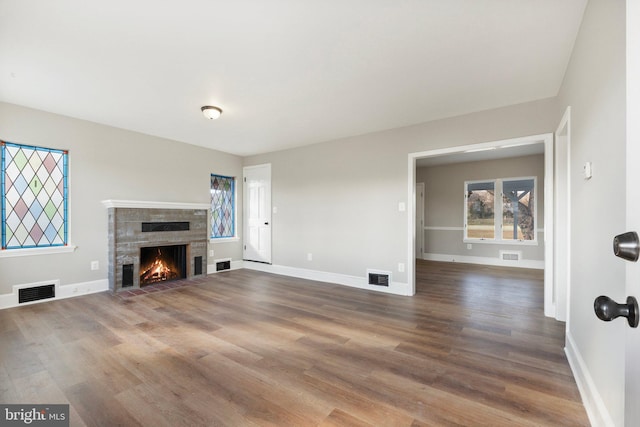 unfurnished living room with hardwood / wood-style floors