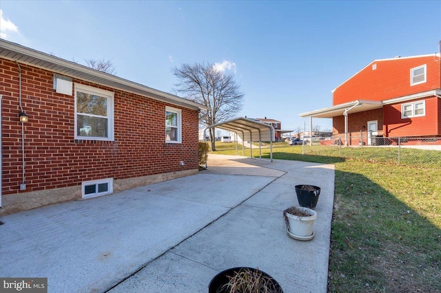 view of property exterior featuring a yard and a carport