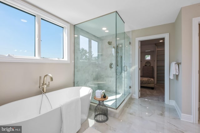 bathroom featuring independent shower and bath