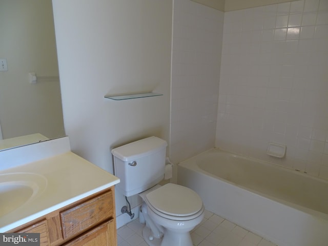 full bathroom featuring tile patterned floors, vanity, tiled shower / bath combo, and toilet