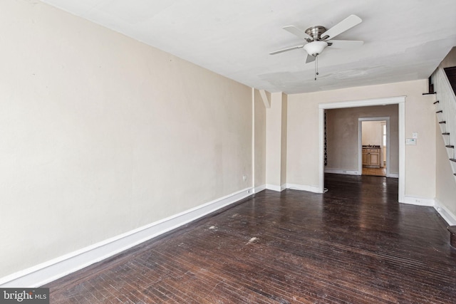 unfurnished room with ceiling fan and dark hardwood / wood-style flooring