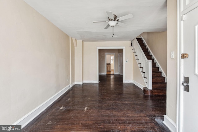 interior space featuring ceiling fan and dark hardwood / wood-style flooring