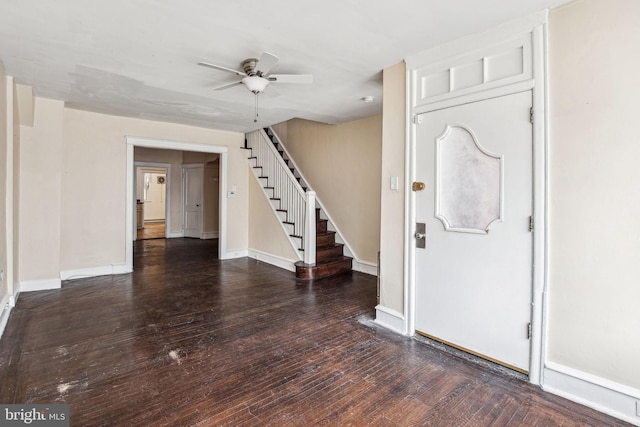 entryway with dark hardwood / wood-style floors and ceiling fan