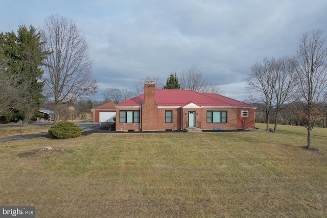 ranch-style home with a front yard and a garage