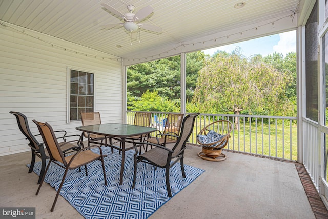 sunroom / solarium with ceiling fan and a healthy amount of sunlight