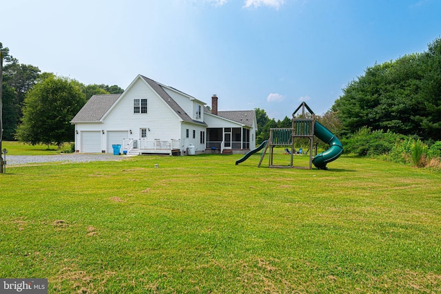 exterior space featuring a lawn and a deck