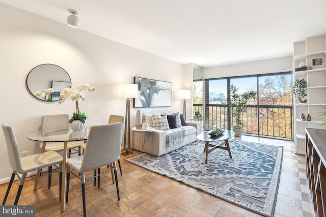 living room featuring parquet flooring